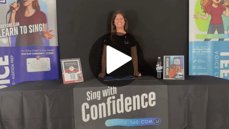 Meghan McCall, vocal coach, stands at a Voice 360 booth table during the Palm Beach Homeschool Expo 2025, with raffle entry signs, promotional posters, and a water bottle displayed.