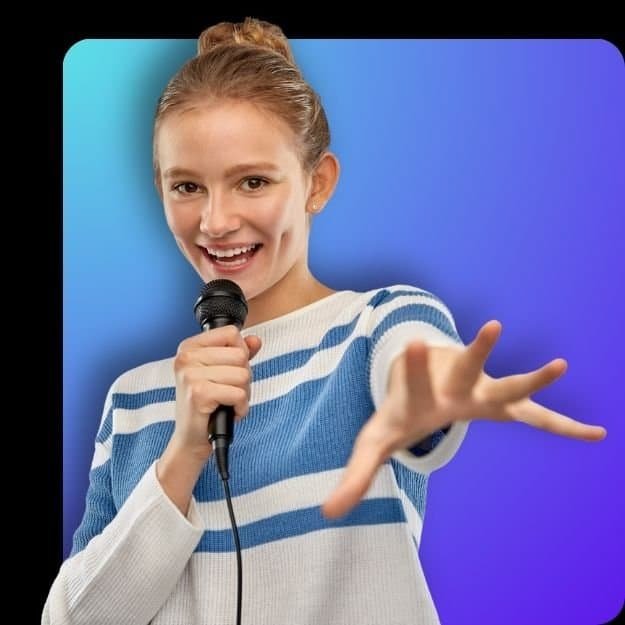Teen girl smiling and singing into a microphone with confidence during Voice 360 online lessons