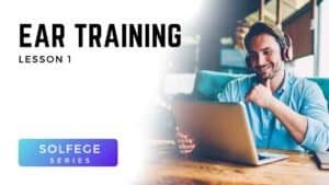 Man using laptop with headphones for Voice 360 Solfège Series ear training lesson