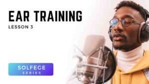 Male singer practicing pitch accuracy with headphones and microphone in Voice 360 Solfège Series ear training lesson