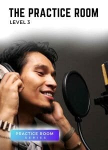 Male singer recording vocals with headphones and microphone in Voice 360 Practice Room Level 3 lesson