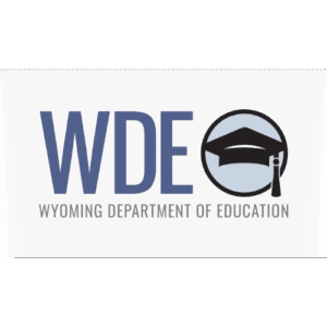 Wyoming Department of Education (WDE) logo featuring bold blue letters “WDE” alongside a circular icon with a graduation cap in black and gray.