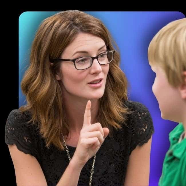 Vocal coach giving instruction to young student during lesson